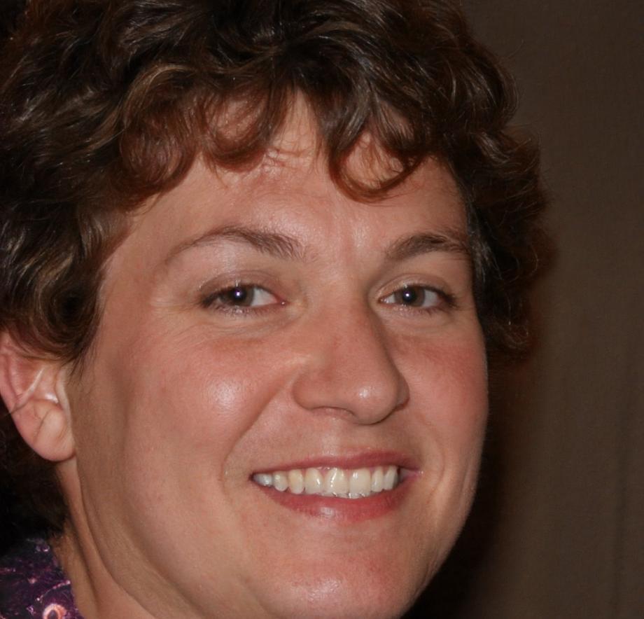 Financial educator Sarah reviewing budget planning materials