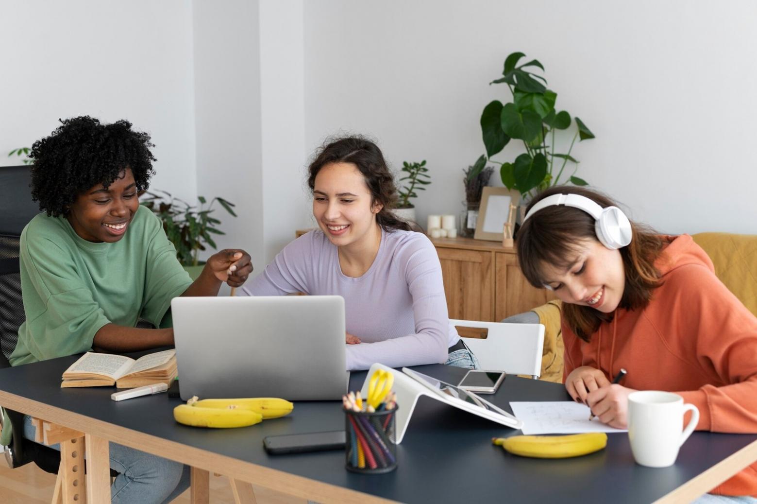 Person reviewing financial documents with calculator and coffee on desk